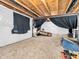 Partially furnished basement with a carpeted area, offering potential for a cozy living or recreational space at 6044 Shallow Crk Ln, Indianapolis, IN 46237