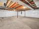 Spacious unfinished basement offering a blank canvas with white walls and exposed ceiling beams for future customization at 6044 Shallow Crk Ln, Indianapolis, IN 46237