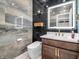 Stunning bathroom features sleek tile work, modern fixtures, stylish vanity, and contemporary toilet at 6044 Shallow Crk Ln, Indianapolis, IN 46237
