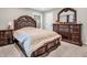Bedroom featuring a dark wood sleigh bed, matching furniture, and plenty of storage space at 6044 Shallow Crk Ln, Indianapolis, IN 46237