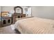 Bedroom featuring tufted bed, stylish nightstands, with a traditional dresser and decorations at 6044 Shallow Crk Ln, Indianapolis, IN 46237