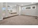 Open bedroom layout with recessed ceilings, large windows, and elevated platform, creating a stylish retreat at 6044 Shallow Crk Ln, Indianapolis, IN 46237