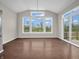 Bright dining area with large windows offering backyard views and an abundance of natural light at 6044 Shallow Crk Ln, Indianapolis, IN 46237