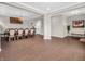 Open concept dining area featuring hardwood floors and an elegant dining set with chandelier at 6044 Shallow Crk Ln, Indianapolis, IN 46237