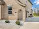Charming home exterior with brick facade, arched entry, and well-maintained landscaping at 6044 Shallow Crk Ln, Indianapolis, IN 46237