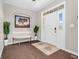 Inviting foyer showcasing hardwood floors, a stylish bench, decor, and a grand front door at 6044 Shallow Crk Ln, Indianapolis, IN 46237