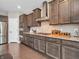 Updated kitchen with stainless appliances, gas range, sleek cabinetry, and modern backsplash at 6044 Shallow Crk Ln, Indianapolis, IN 46237