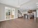 Open-concept living space with kitchen, dining area, and sliding glass doors to outdoor deck at 6044 Shallow Crk Ln, Indianapolis, IN 46237