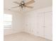Clean bedroom featuring neutral carpet, a ceiling fan and double door closets at 6315 Hansbrough Way, Indianapolis, IN 46268
