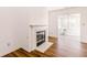 Cozy fireplace with white mantel, seamlessly integrated with the living space at 6315 Hansbrough Way, Indianapolis, IN 46268