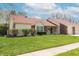 Charming single-story home with a red roof, brick accents, and well-maintained lawn at 6315 Hansbrough Way, Indianapolis, IN 46268