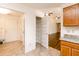 Open concept kitchen features an adjacent pantry and an entryway to the living room at 6315 Hansbrough Way, Indianapolis, IN 46268