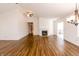 Spacious living room featuring hardwood floors, recessed lighting, and a cozy fireplace at 6315 Hansbrough Way, Indianapolis, IN 46268