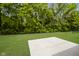 Spacious backyard featuring a concrete patio and lush green lawn, perfect for outdoor entertaining at 6474 Ambassador Dr, Plainfield, IN 46168