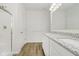 Bright bathroom with dual sinks, granite countertops, and a glass-enclosed shower at 6474 Ambassador Dr, Plainfield, IN 46168