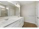 Bright bathroom features a double sink vanity with quartz counters and a glass enclosed shower at 6474 Ambassador Dr, Plainfield, IN 46168