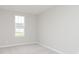 Bedroom with neutral carpet, white walls, and a window at 6474 Ambassador Dr, Plainfield, IN 46168