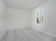 A bedroom with a large window provides natural light and a peaceful atmosphere at 6474 Ambassador Dr, Plainfield, IN 46168