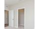 Bedroom with neutral carpet, white walls, and access to closet at 6474 Ambassador Dr, Plainfield, IN 46168