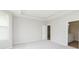 Bedroom with neutral walls and carpet flooring with an attached bathroom at 6474 Ambassador Dr, Plainfield, IN 46168