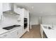 Modern kitchen with white cabinets, stainless steel appliances, and a subway tile backsplash at 6474 Ambassador Dr, Plainfield, IN 46168