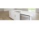 Kitchen island featuring a stainless steel sink and dishwasher at 6474 Ambassador Dr, Plainfield, IN 46168