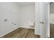 Well-equipped laundry room featuring a utility sink and hookups for your washer and dryer at 6474 Ambassador Dr, Plainfield, IN 46168