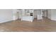 Open-concept living room and kitchen with hardwood floors at 6474 Ambassador Dr, Plainfield, IN 46168