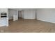 Spacious living room with hardwood floors and neutral paint at 6474 Ambassador Dr, Plainfield, IN 46168