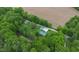 Beautiful aerial view showing a home, a small pond, and a field, surrounded by lush greenery at 685 N Buffalo Hill Rd, Martinsville, IN 46151