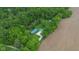A high angle shot showcases the home, long driveway, detached garage, and wooded surroundings at 685 N Buffalo Hill Rd, Martinsville, IN 46151