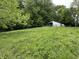 Exterior of a Morton barn surrounded by lush green trees and fields at 685 N Buffalo Hill Rd, Martinsville, IN 46151