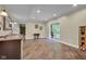 An open basement featuring wood-look floors, a bar sink area, and a sliding glass door at 685 N Buffalo Hill Rd, Martinsville, IN 46151