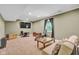 Finished basement area features a sofa, recliner, window, TV and storage at 685 N Buffalo Hill Rd, Martinsville, IN 46151