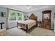 Well-lit bedroom with large window, antique furniture, and ceiling fan at 685 N Buffalo Hill Rd, Martinsville, IN 46151
