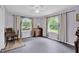 A well-lit bedroom with a ceiling fan and two windows that provide a view of the outdoors and nice curtains at 685 N Buffalo Hill Rd, Martinsville, IN 46151