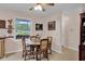 Cozy dining area featuring a wooden table and chairs, with natural light coming through the window at 685 N Buffalo Hill Rd, Martinsville, IN 46151