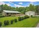 Inviting home featuring a charming porch, well-manicured lawn, and a convenient two-car detached garage at 685 N Buffalo Hill Rd, Martinsville, IN 46151