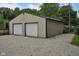 Exterior view of a two-door garage with gravel driveway at 685 N Buffalo Hill Rd, Martinsville, IN 46151