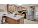 Cozy kitchen features wood cabinets, tile backsplash, and stainless steel refrigerator at 685 N Buffalo Hill Rd, Martinsville, IN 46151