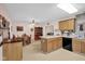 Open-concept kitchen and dining area, with wood cabinets and modern appliances at 685 N Buffalo Hill Rd, Martinsville, IN 46151
