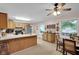 Spacious kitchen with breakfast bar flows into the dining area with natural light at 685 N Buffalo Hill Rd, Martinsville, IN 46151