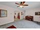 Open living room with neutral paint, ceiling fan, and views into other rooms at 685 N Buffalo Hill Rd, Martinsville, IN 46151