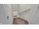 A carpeted staircase with a white handrail, leading to the upper or lower level of the house at 685 N Buffalo Hill Rd, Martinsville, IN 46151