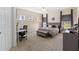 Spacious bedroom featuring neutral carpet, ceiling fan, a desk and a large window overlooking the property at 7067 Hart St, Cumberland, IN 46229