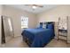 Cozy bedroom with ceiling fan, soft carpet and window letting in natural light at 7067 Hart St, Cumberland, IN 46229