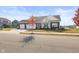 Charming one-story home with a three car garage, neutral siding, and a tree in the front yard at 7067 Hart St, Cumberland, IN 46229