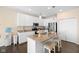 Stylish kitchen with granite counters, stainless steel appliances, and a functional center island with seating at 7067 Hart St, Cumberland, IN 46229