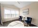 Bright sitting room features a ceiling fan, vaulted ceiling, and two plush chairs at 7067 Hart St, Cumberland, IN 46229