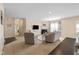 Inviting living room with fireplace, plush seating, and neutral decor for relaxation and entertainment at 7067 Hart St, Cumberland, IN 46229